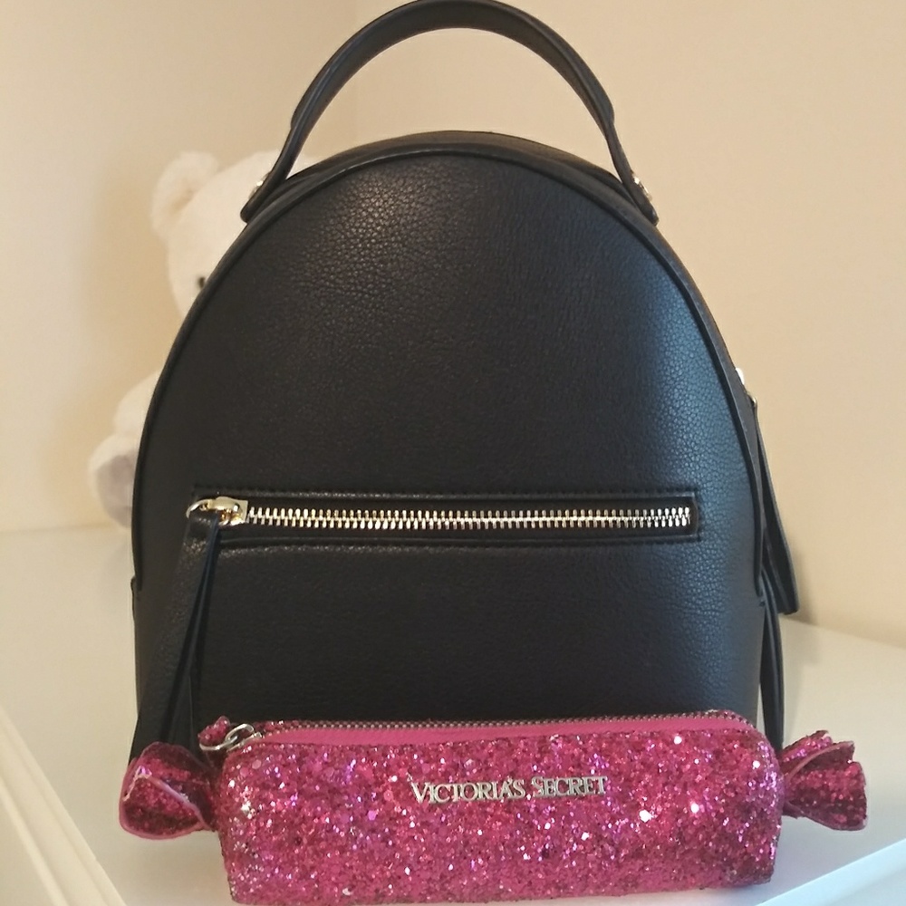 Black Mini Backpack with free cosmetic bag.
